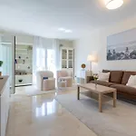 Elegant Marbella Apartment, 5-Pool Oasis, Sunlit Terrace, Garage